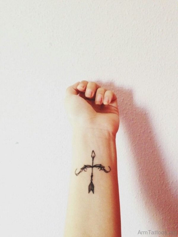 Adorable Tiny Bow And Arrow Tattoo On Wrist