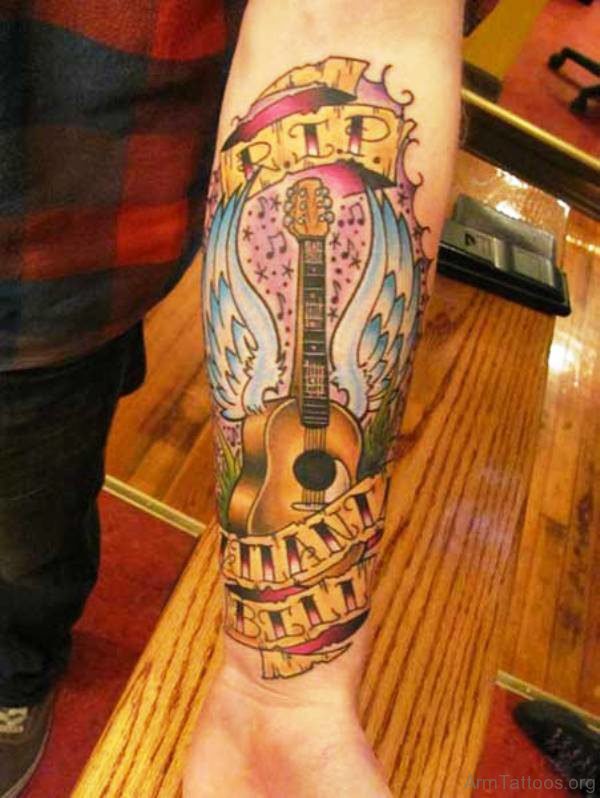 Amazing Guitar Tattoo With Wings On Arm 