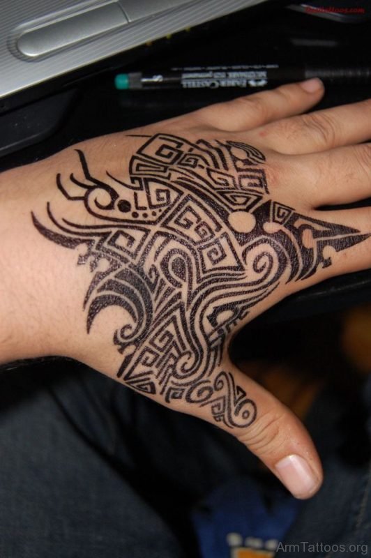 Attractive Black Ink Tribal Tattoo On Left Hand
