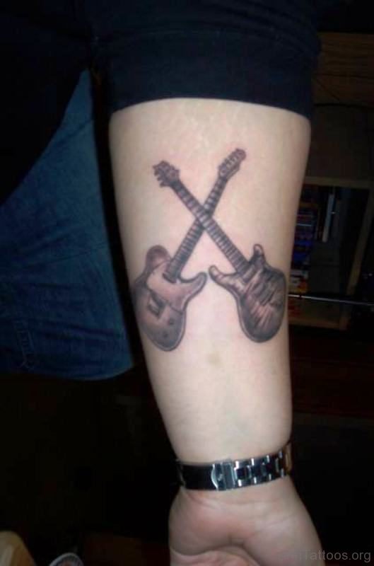 Attractive Cross Guitar Tattoo On Arm 
