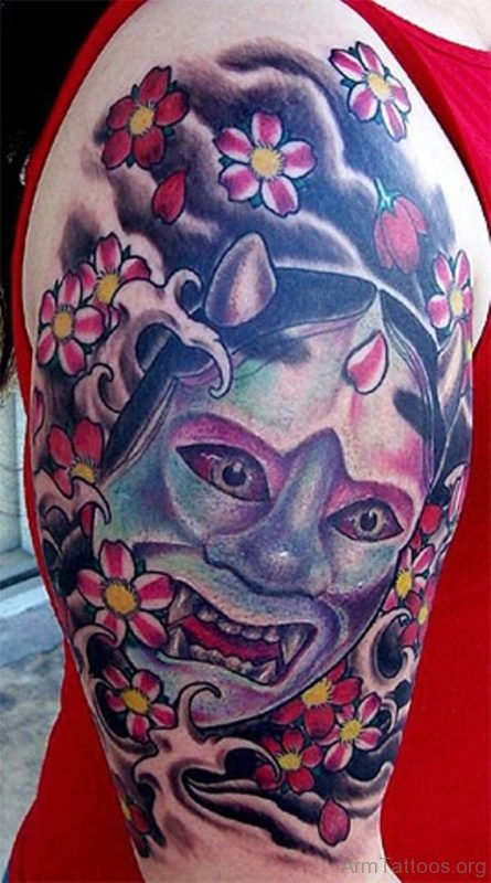 Attractive Oni Mask Tattoo On Arm 