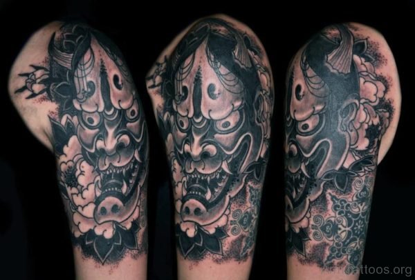 Black And Grey Hannya Mask Tattoo On Left Arm 