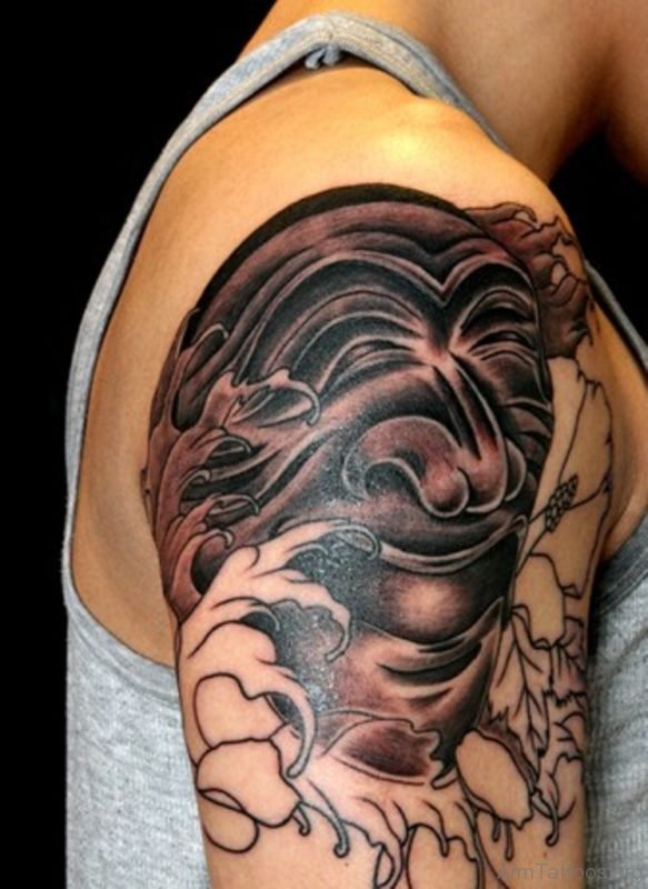 Black And Grey Korean Mask Tattoo On Arm 