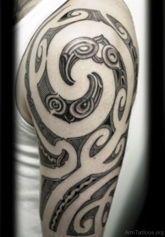 Black And Grey Maori Tattoo On Arm 