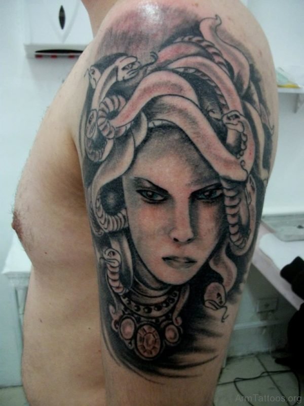 Black And Grey Medusa Tattoo On Man Left Arm 