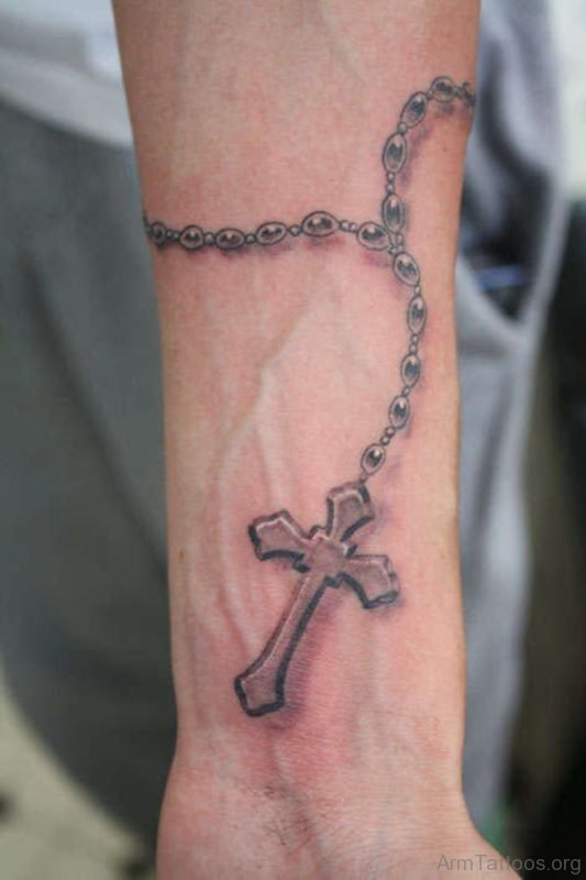 Black And Grey Rosary Cross Tattoo On Forearm