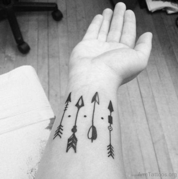 Black And White Arrows Tattoo On Arm