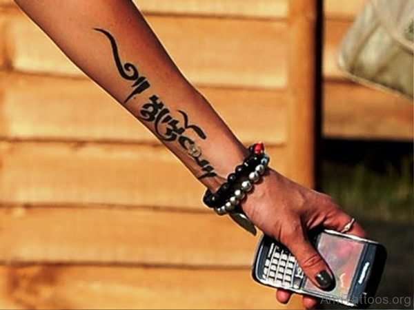 Black Arabic Tattoo On Arm 