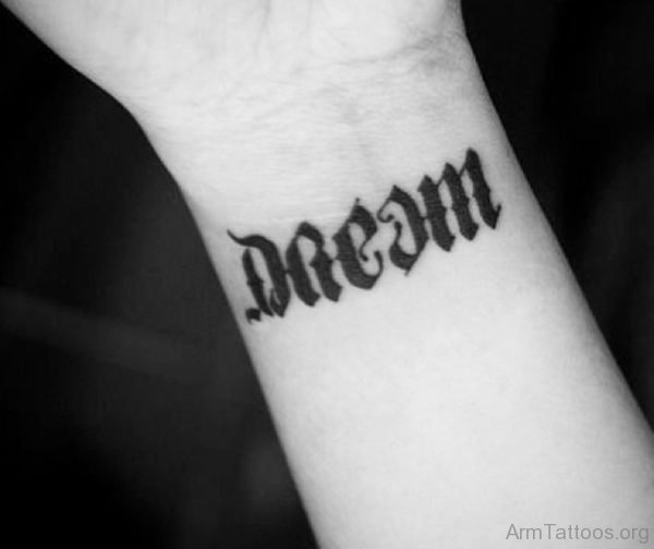 Black Ink Dream Ambigram Tattoo On Wrist