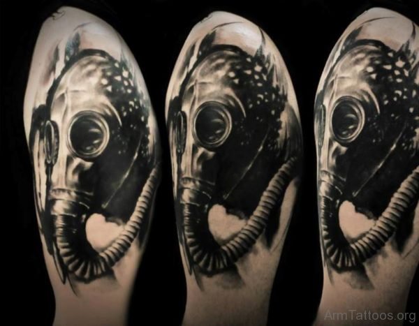 Black Ink Gas Mask Tattoo On Left Arm 