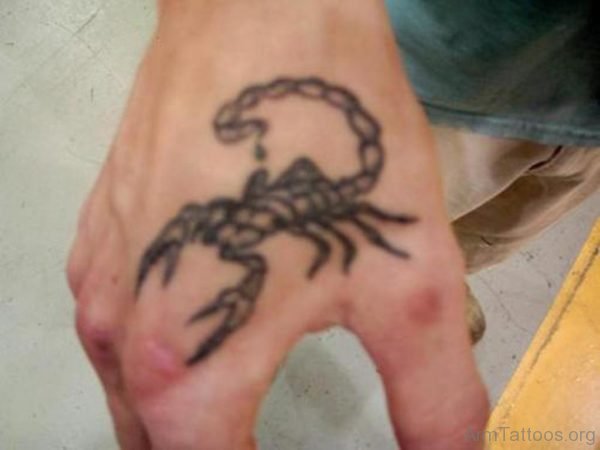 Black Ink Scorpion Tattoo On Hand