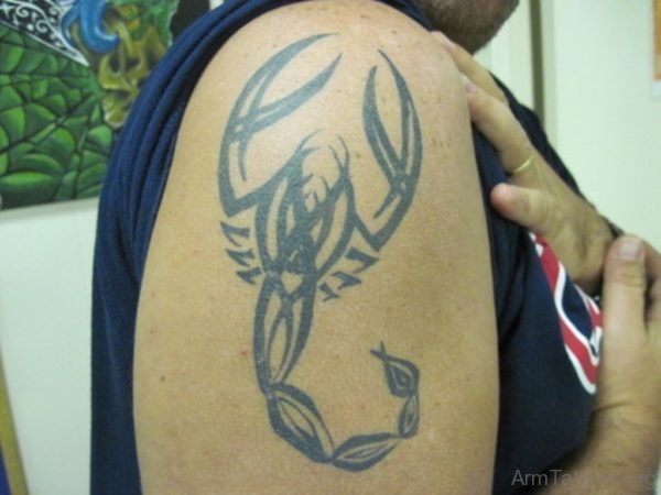 Black Ink Tribal Scorpion Tattoo On Shoulder