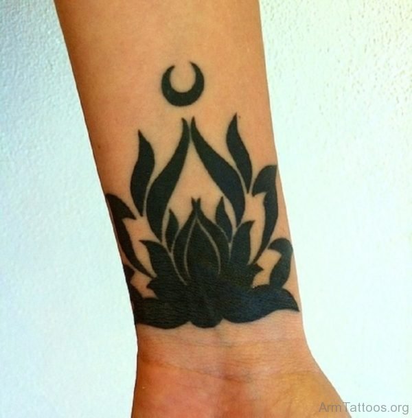 Black Inked Lotus Tattoo On Arm 