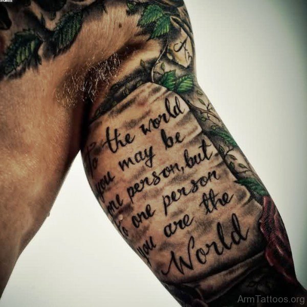 Black Lettering Scroll Tattoo On Arm 