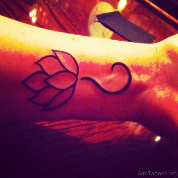 Black Outline Lotus Tattoo On Arm 