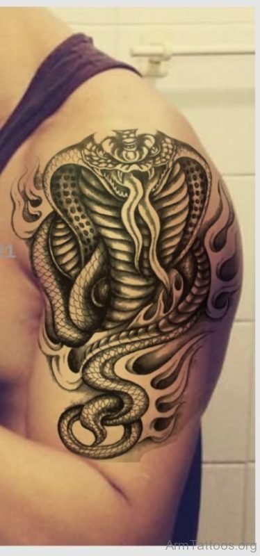 Black Snake In Fire And Flame Tattoo On Man Left Shoulder