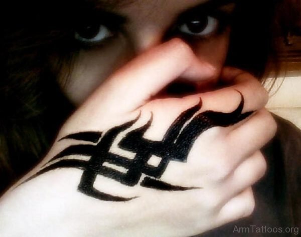 Bold Black Tribal Tattoo On Hand