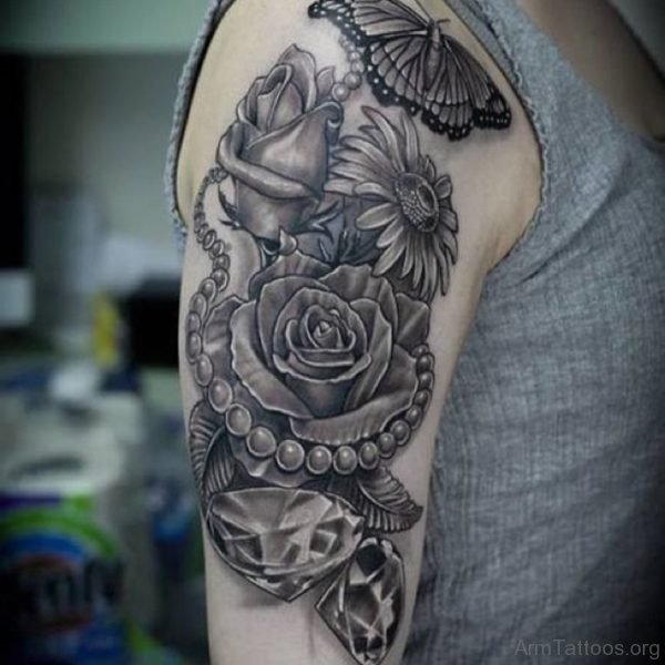 Butterflies And Skull Tattoos On Arm