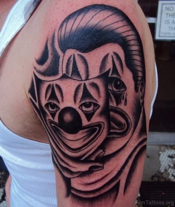 Clown Mask Tattoo On Left Arm 