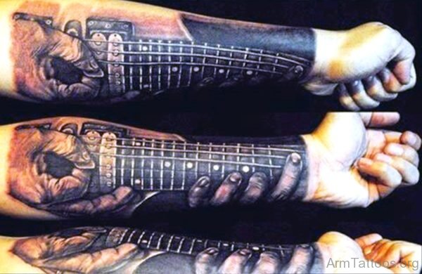 Creative Guitar Tattoo On Arm 