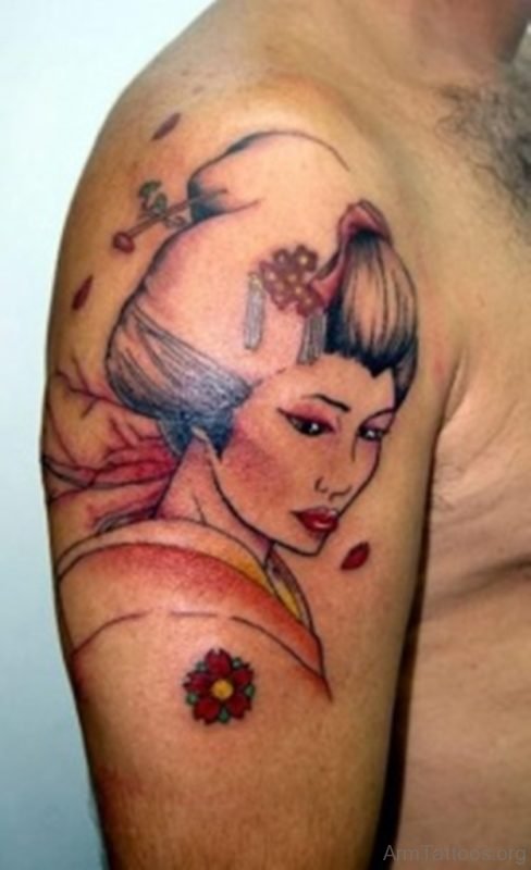 Cute colored Asian geisha tattoo on shoulder with flowers