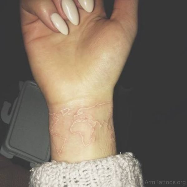 Cute tiny white map tattoo on wrist