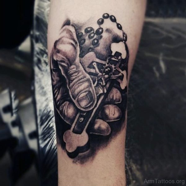 Hand Holding Rosary Tattoo On Forearm