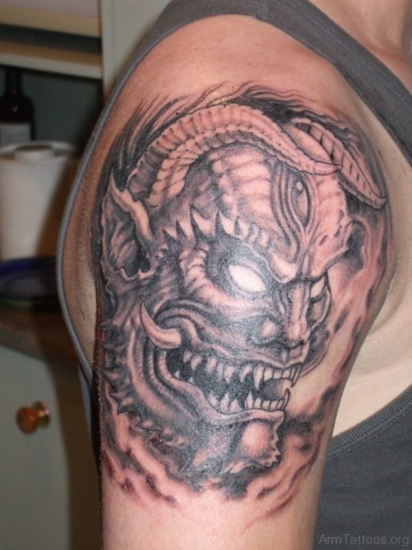 Demon Mask Tattoo On Arm 