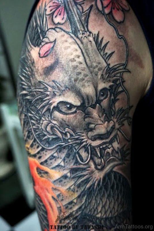 Dragon Face Tattoo On Arm
