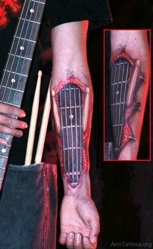 Elegant Red And Black Guitar Tattoo On Forearm 