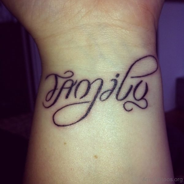 Family Black Ink Ambigram Tattoo On Wrist