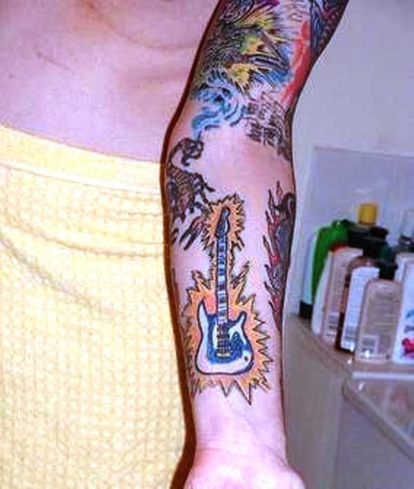 Flaming Guitar Tattoo On Forearm 