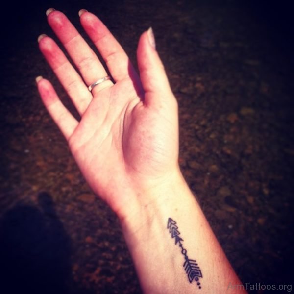 Fresh Black Arrow Tattoo On Arm 