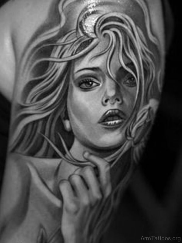 Girl Portrait Tattoo On Bicep 