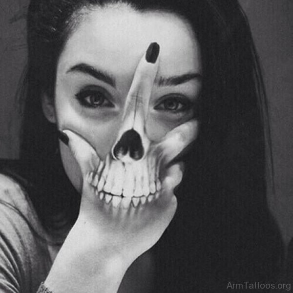 Girl Showing Her Skull Tattoo