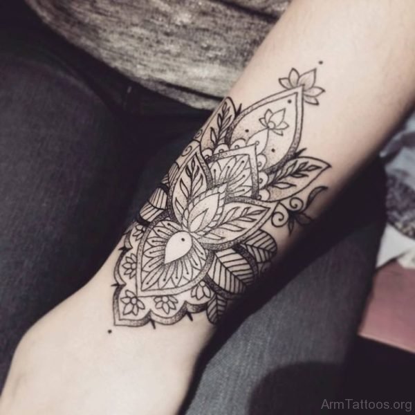 Grey Ink Mandala Tattoo On Arm 