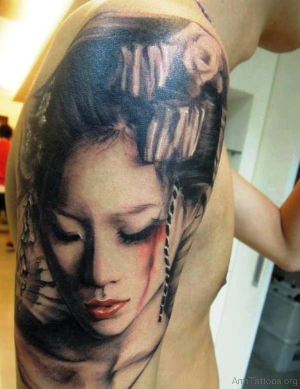 Grey Geisha Face Tattoo On Man Arm