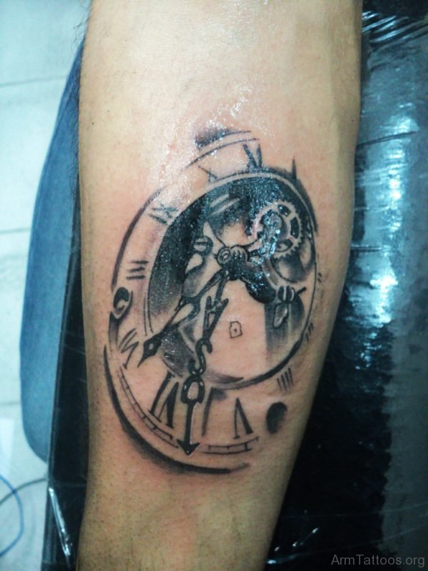 Grey Ink Clock Tattoo On Arm