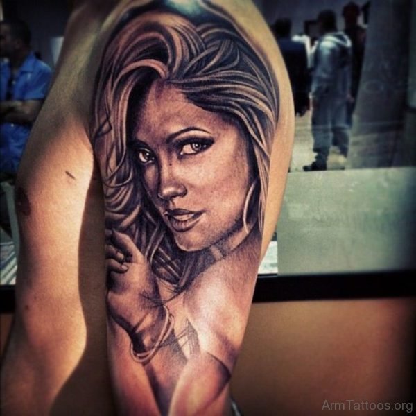 Grey Ink Female Portrait Tattoo On Sleeve