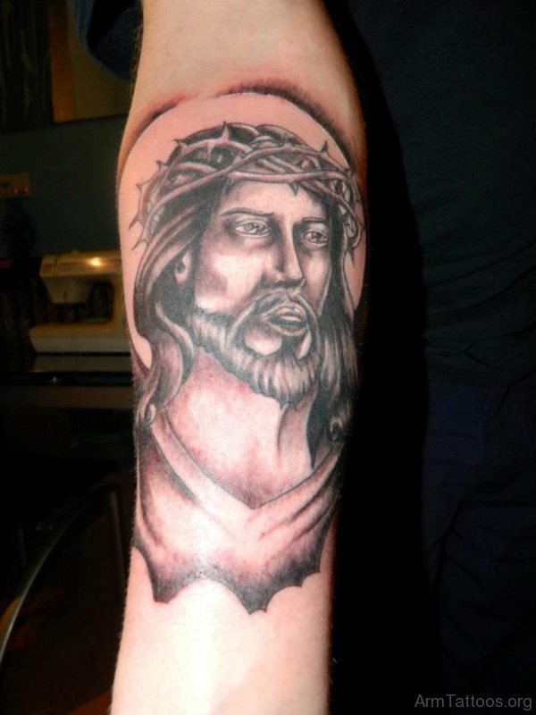 Grey Ink Jesus Face Tattoo On Right Forearm