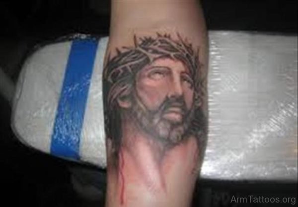 Grey Ink Jesus Head Tattoo On Arm