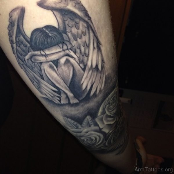 Grey Ink Roses And Fallen Angel Tattoo On Arm