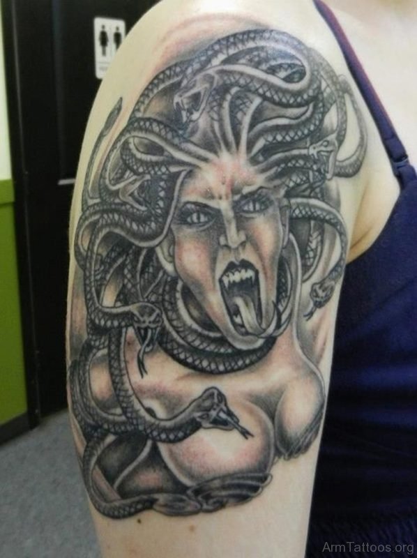 Grey Ink Screaming Medusa Tattoo On Arm 