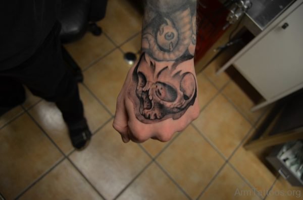 Grey Ink Skull Tattoo On Hand
