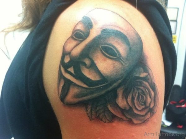 Grey Rose And Mask Tattoo