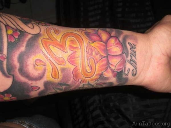 Lotus And Om Tattoo On Arm