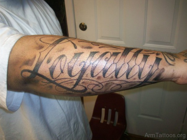 Loyalty Ambigram Tattoo Design On Arm