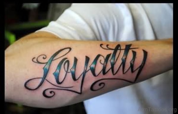 Loyalty Ambigram Tattoo On Right Arm