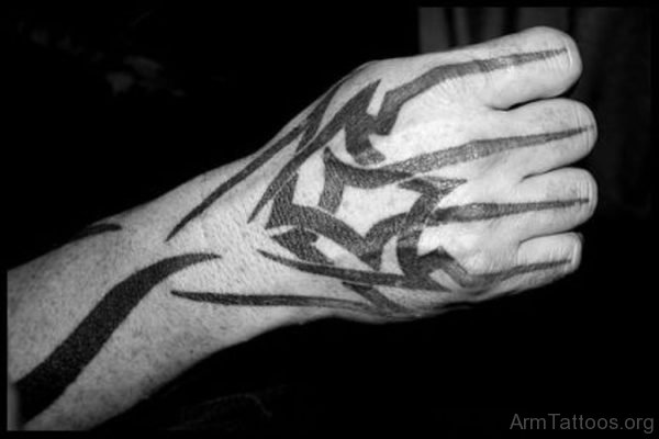 Man With Black Ink Tribal Tattoo On Right Hand