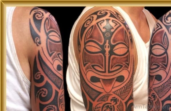 Maori Mask Tattoo On Arm Shoulder